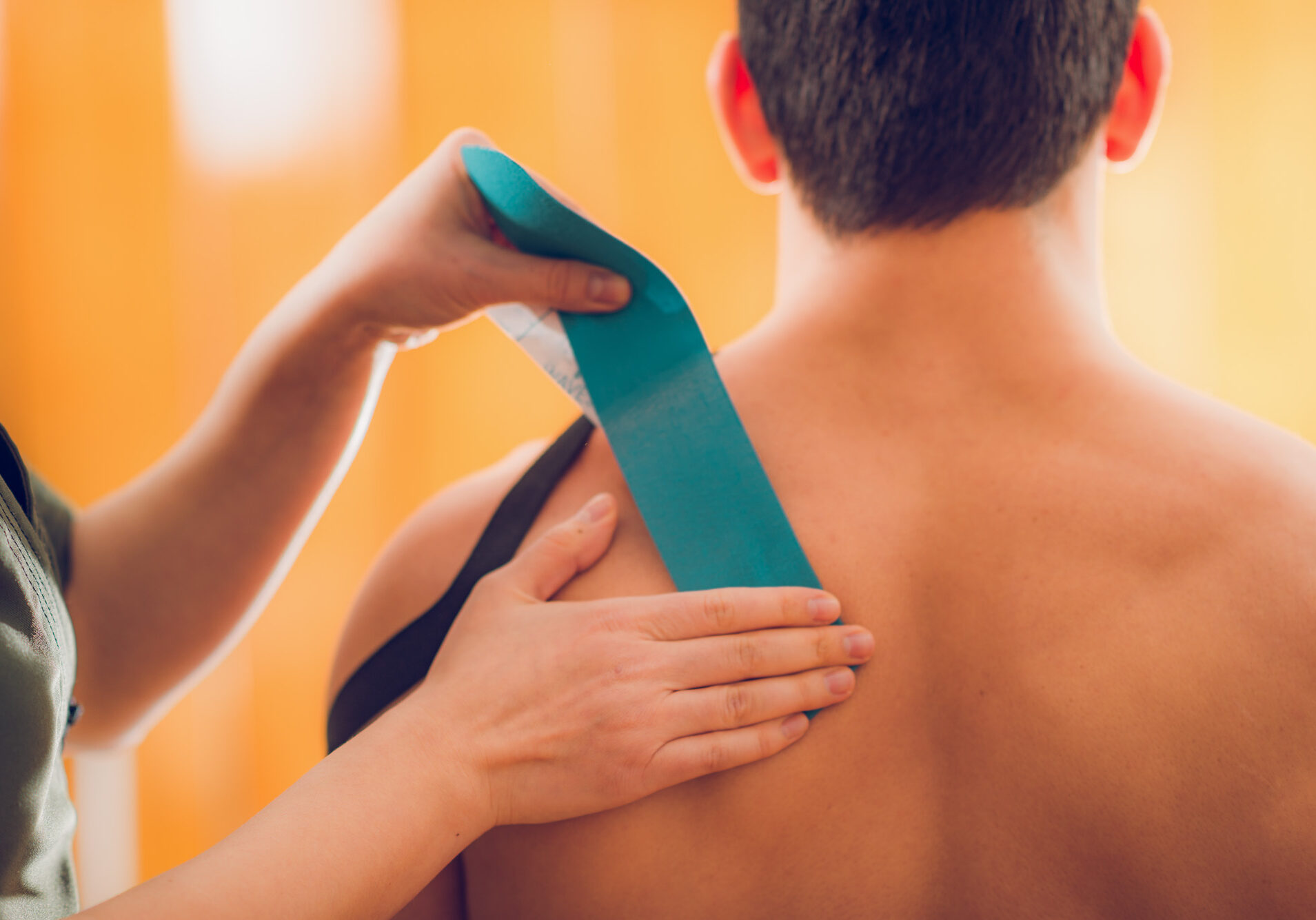 Shoulder treatment with kinesio tape